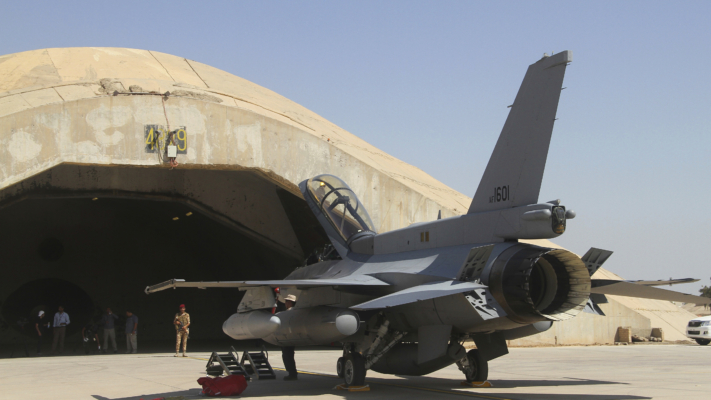 FILE - This July 2015 file photo shows one of four new U.S.- made F-16 fighter jets outside a hardened hangar upon its arrival to Balad air base, north of Baghdad, Iraq. (AP Photo, File)