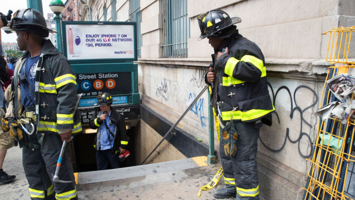Emergency service personnel work at the scene of a subway derailment, Tuesday, June 27, 2017, in the Harlem neighborhood of New York. (AP Photo/Mary Altaffer)