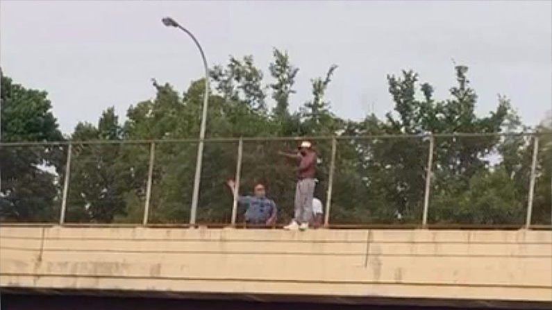 The potential jumper was outside the fence on a very narrow ledge