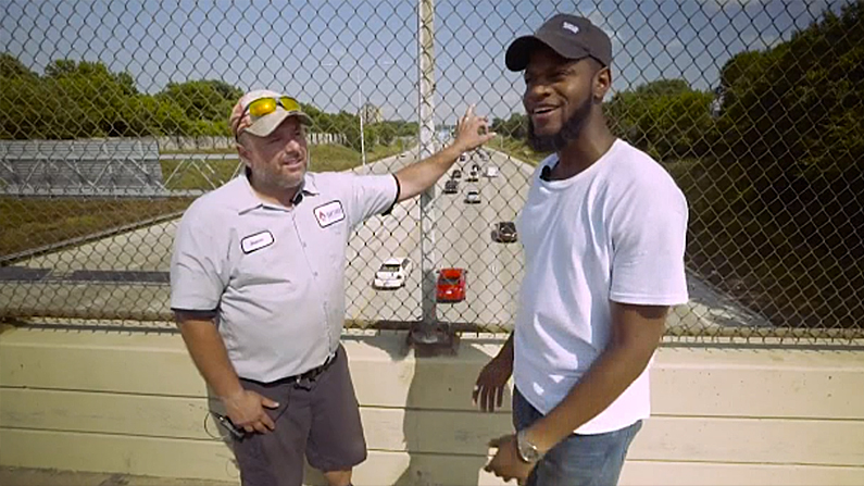 Jason Gabel and Kwame Anderson stand where they talked down a suicidal man