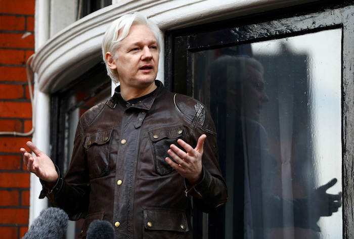 WikiLeaks founder Julian Assange is seen on the balcony of the Ecuadorian Embassy in London, Britain