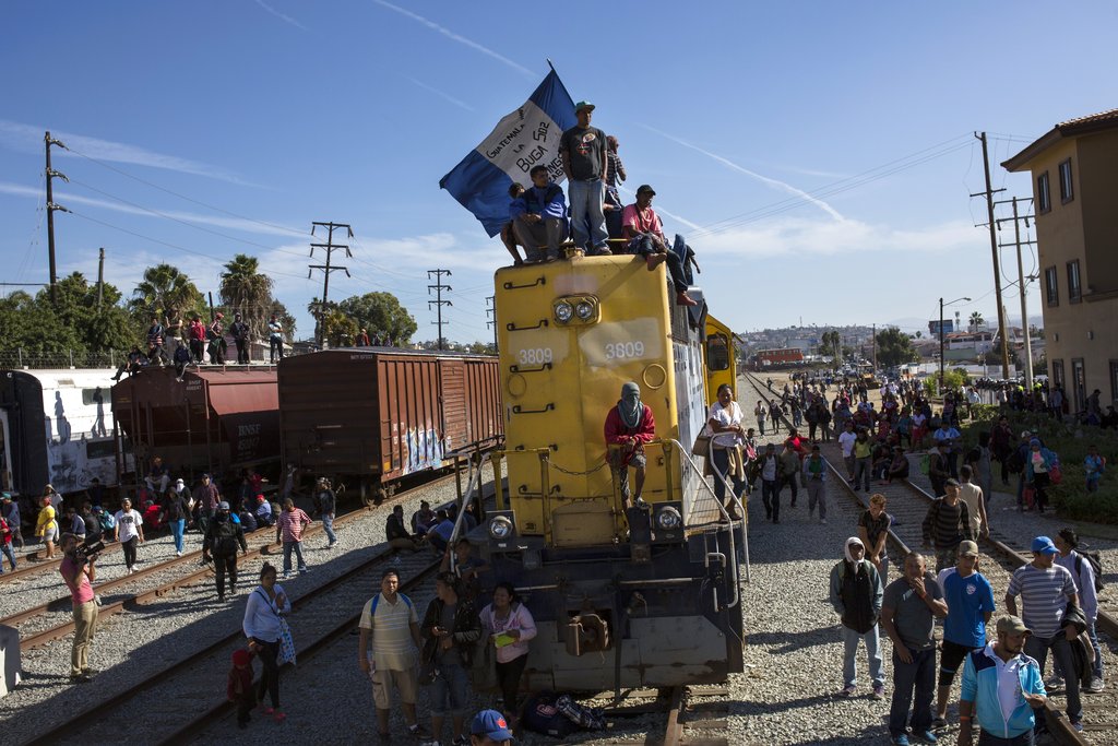 Migrants wave Honduran flag