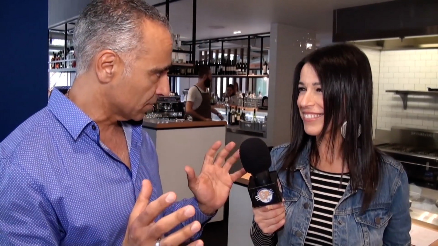 Tina Sofos interviews a shop owner for her food channel on GRTV Australia. (GRTV Australia/Youtube)