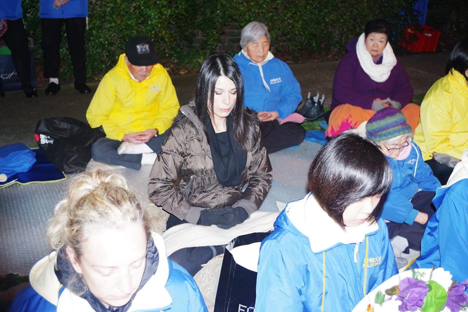 Tina Sofos (middle) practicing the fifth exercise of Falun Dafa with practitioners. (Courtesy of Tina Sofos)