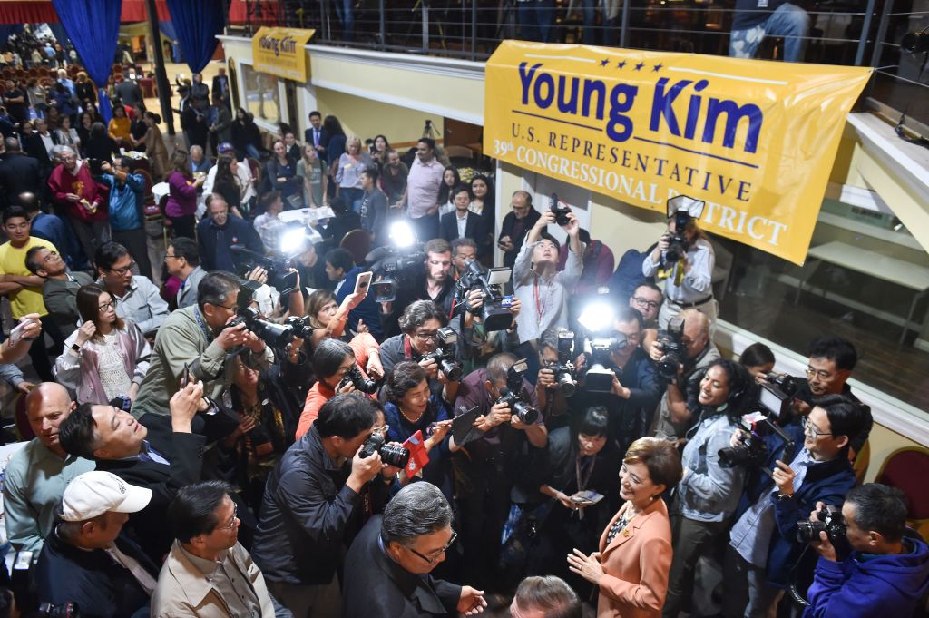 Republican Congressional candidate in California’s 39th District Young Kim (R) is surrounded by supporters and media as she arrives