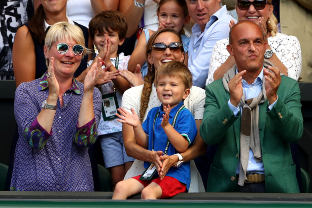 Jelena Djokovic (C), wife of Novak Djokovic of Serbia, and their son Stefan Djokovic applaud 