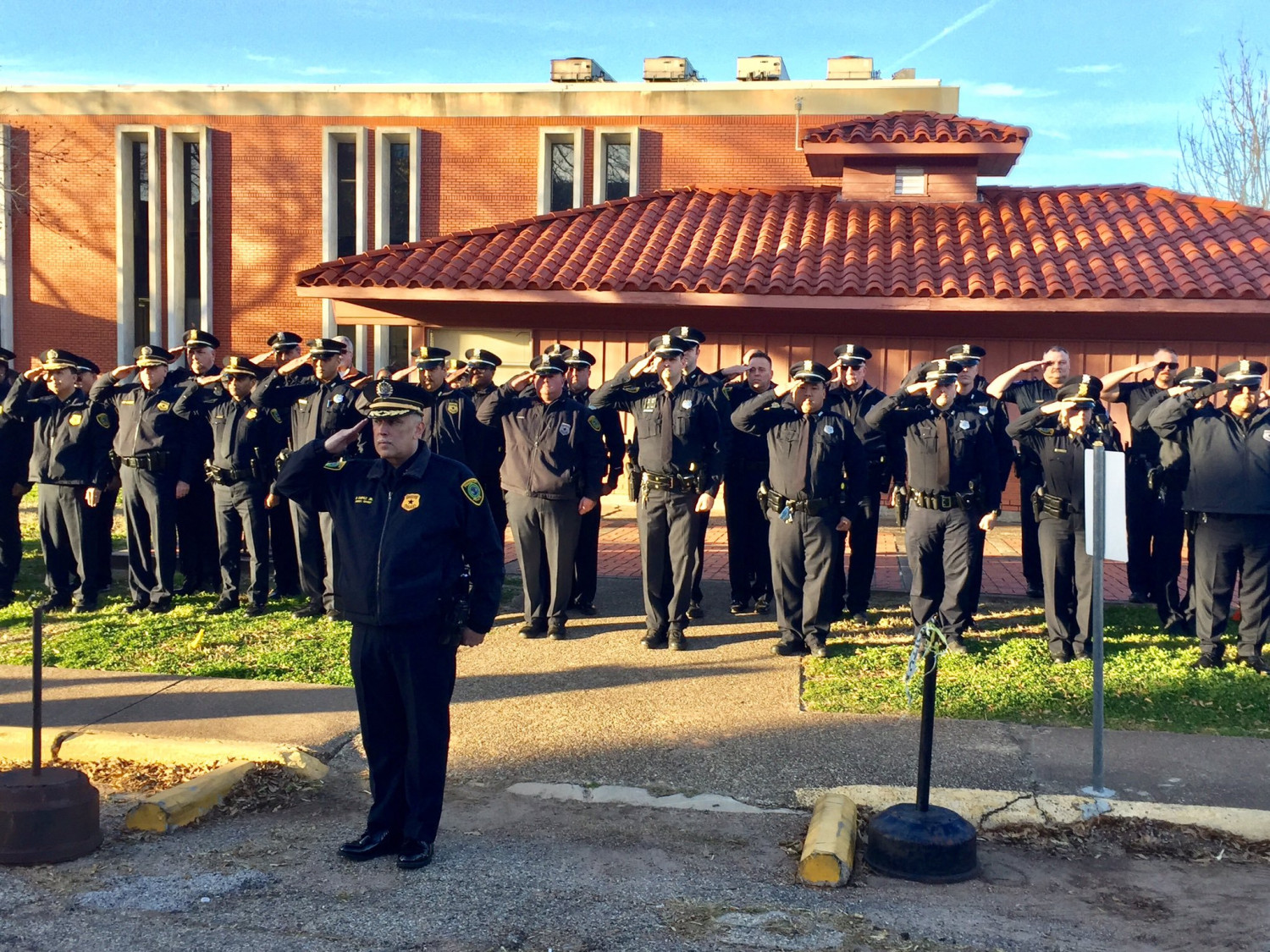 Officer salute outside the prison during the execution of Robert Jennings.