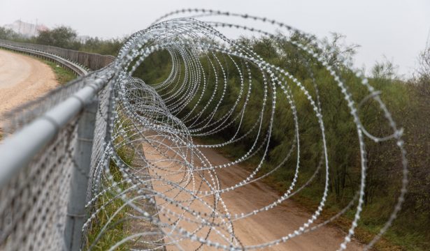 A fence with barbed wire