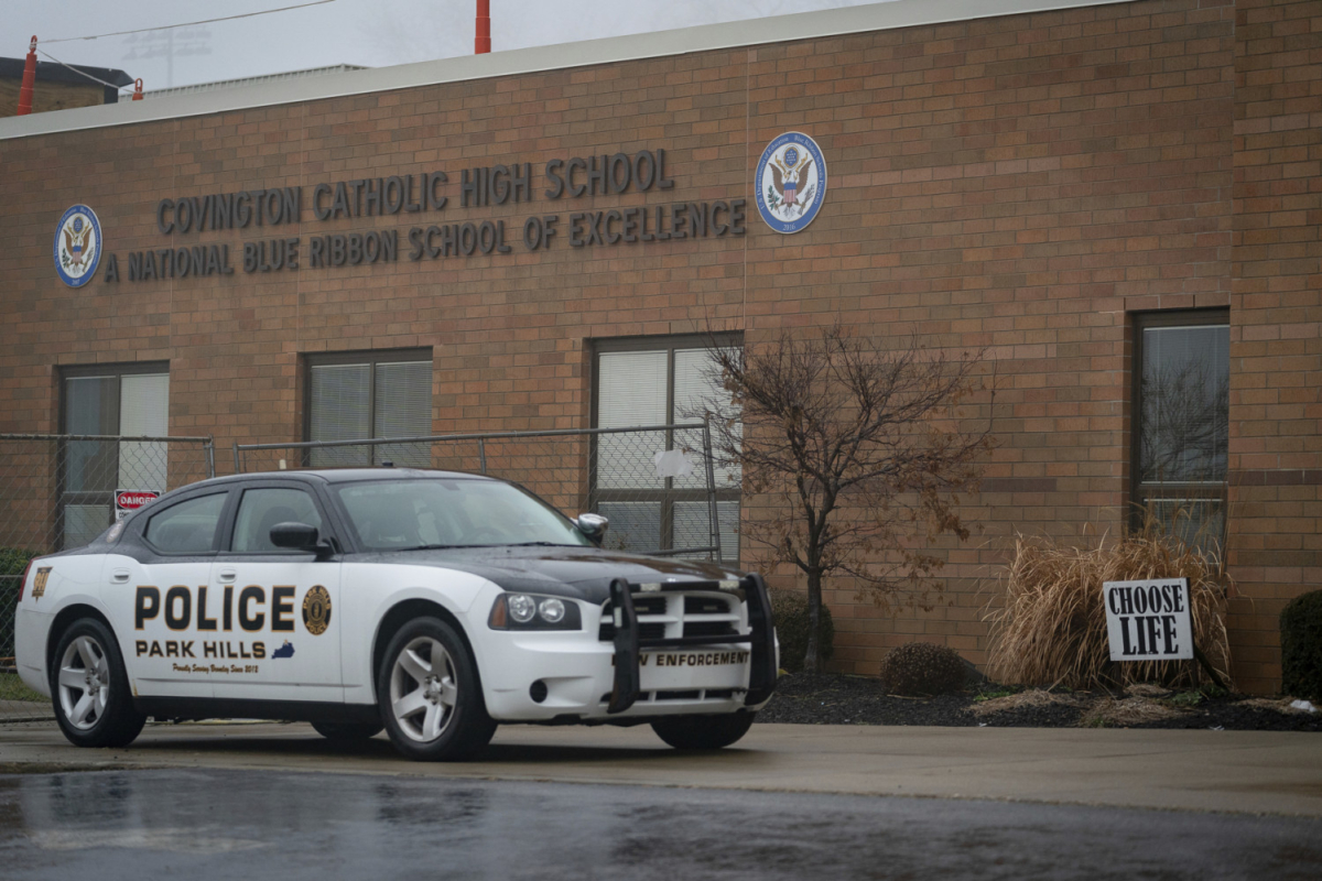 police car in front of Covington Catholic High School