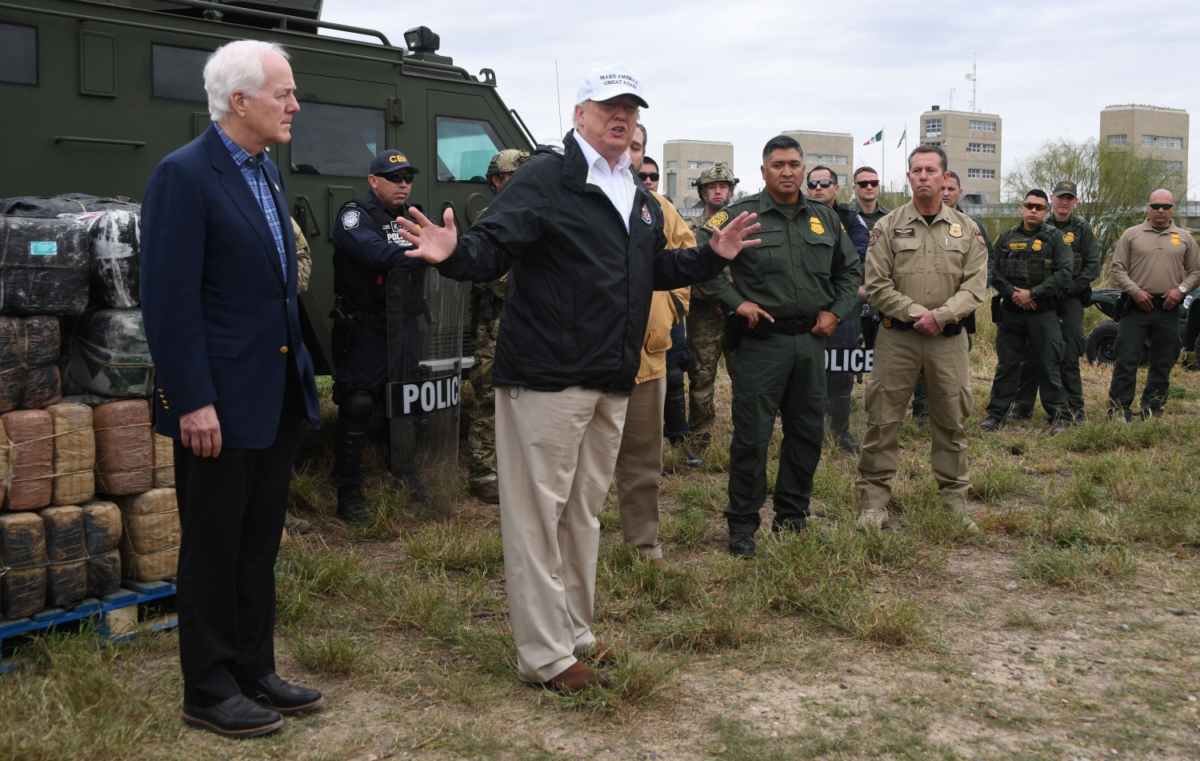 President Donald Trump speaks with Border Patrol agents next to Sen. John Cornyn near the Rio Grande, Texas