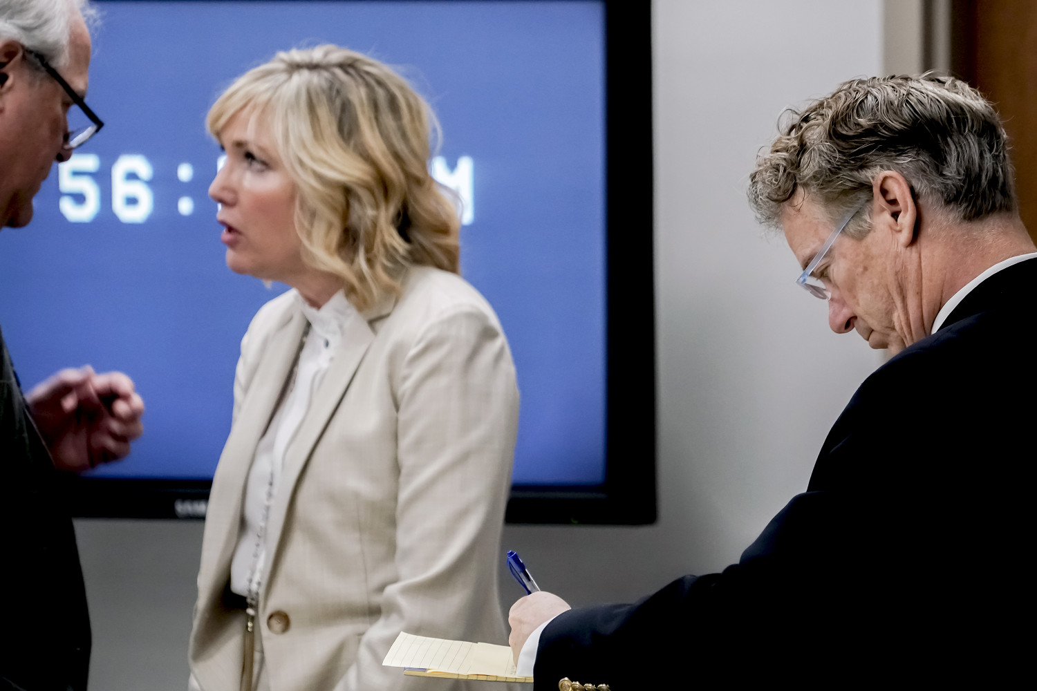 rand paul takes notes in court