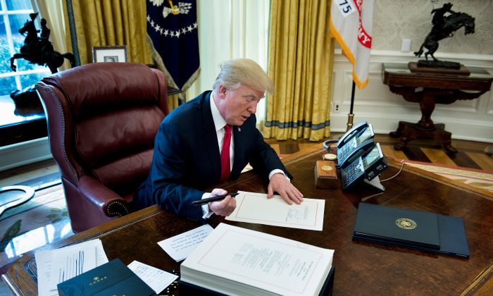 trump signs tax cuts
