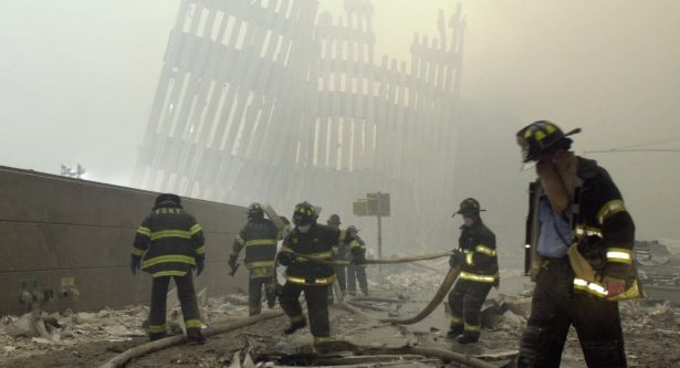 The skeleton of the World Trade Center twin towers in the background