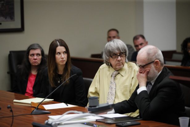 David Turpin, second from right, and wife, Louise, far left, listen to their charges
