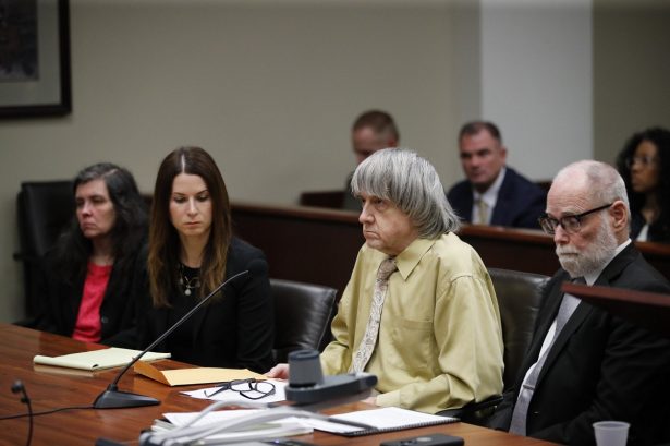 David Turpin, second from right, and wife, Louise, far left, sit in a courtroom with their attorneys