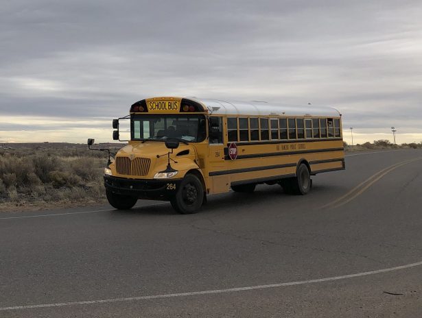 A school bus evacuates students from Sue V. Cleveland High School 