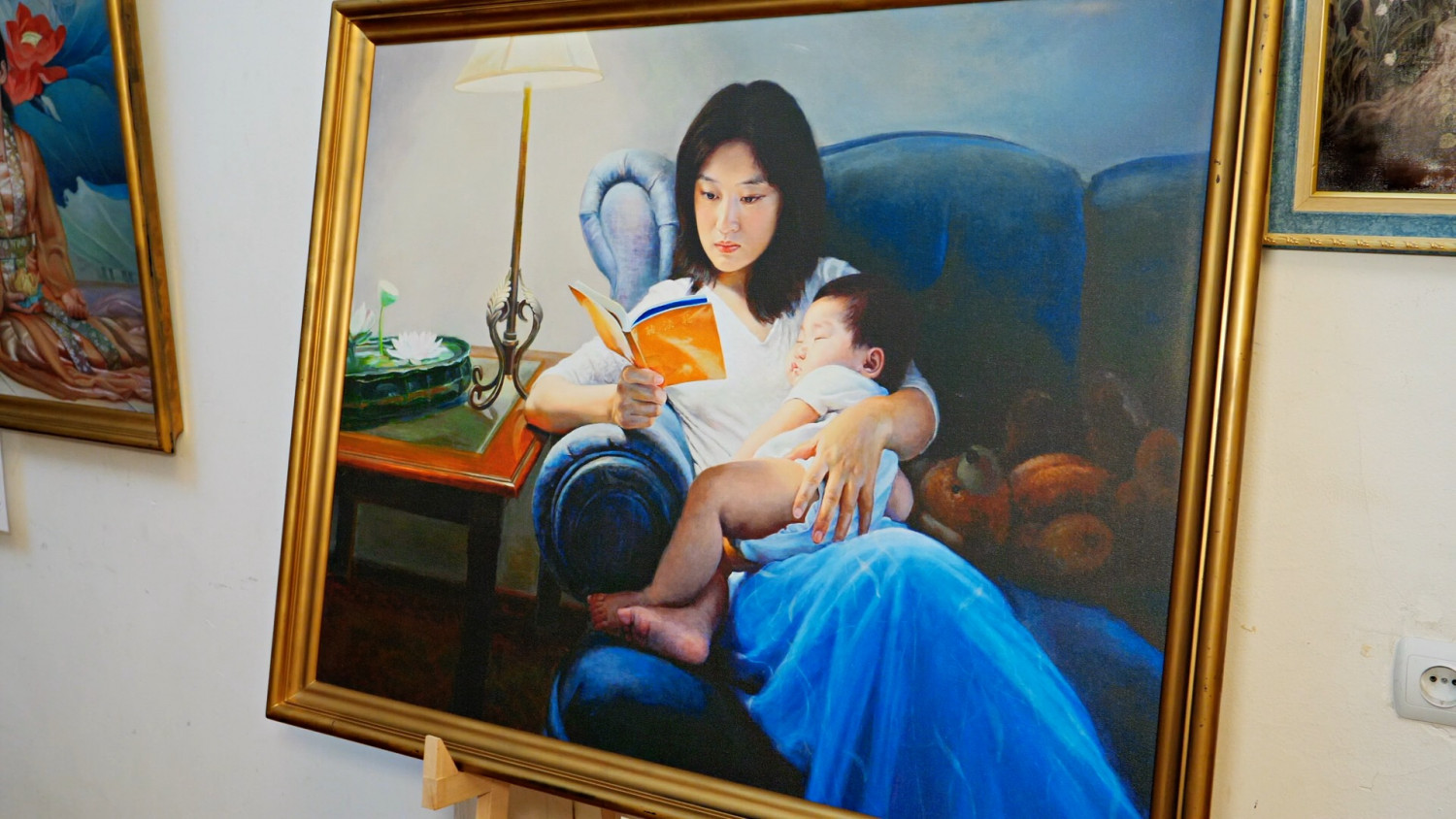 Woman Holding Child and Reading Zhuan Falun..
