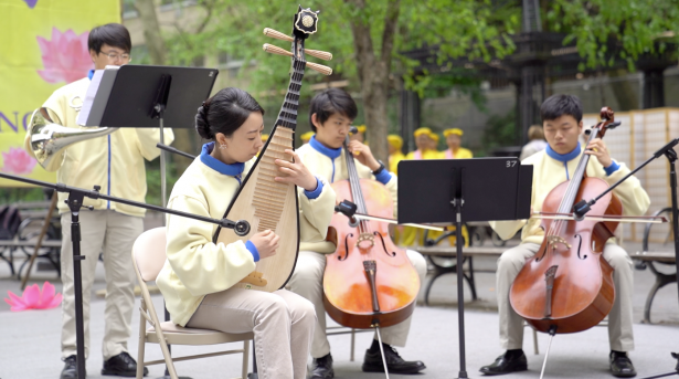 Falun Dafa Practitioners perform instruments in front the United Nations Headquarters in Manhattan on May 9, 2019