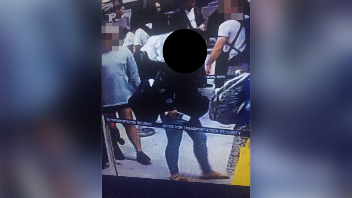 Woman with Baby in Suitcase