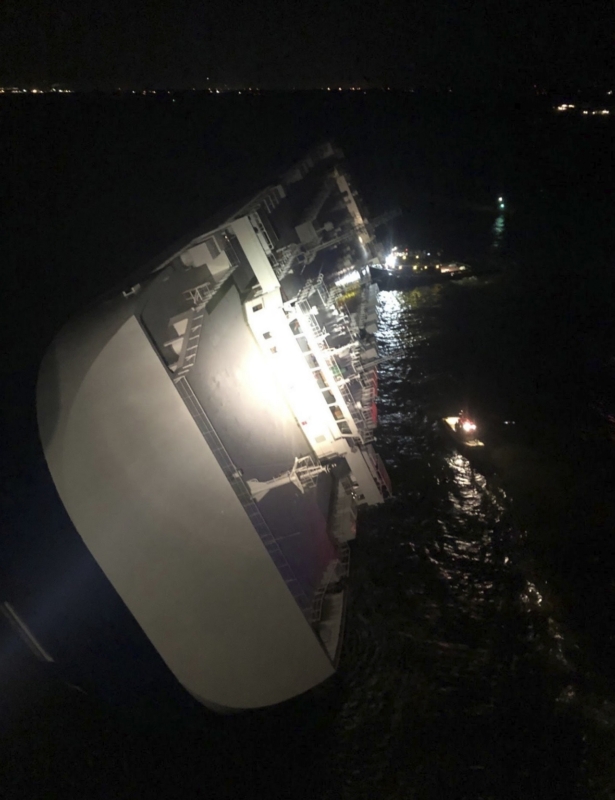The Golden Ray cargo ship lists to one side near a port on the Georgia coast