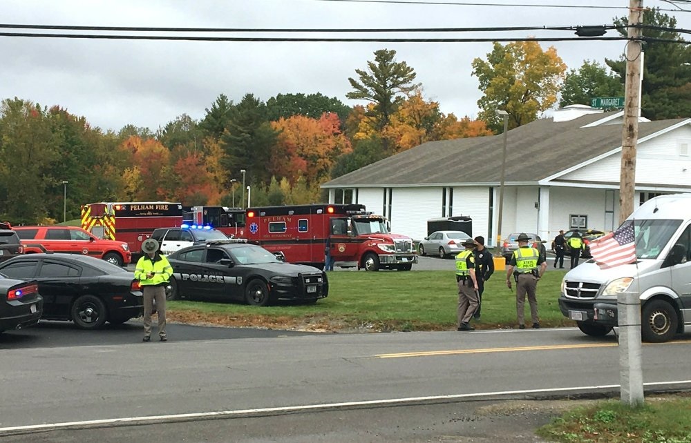 Police stand outside the New England Pentecostal Church after reports of a shooting ,
