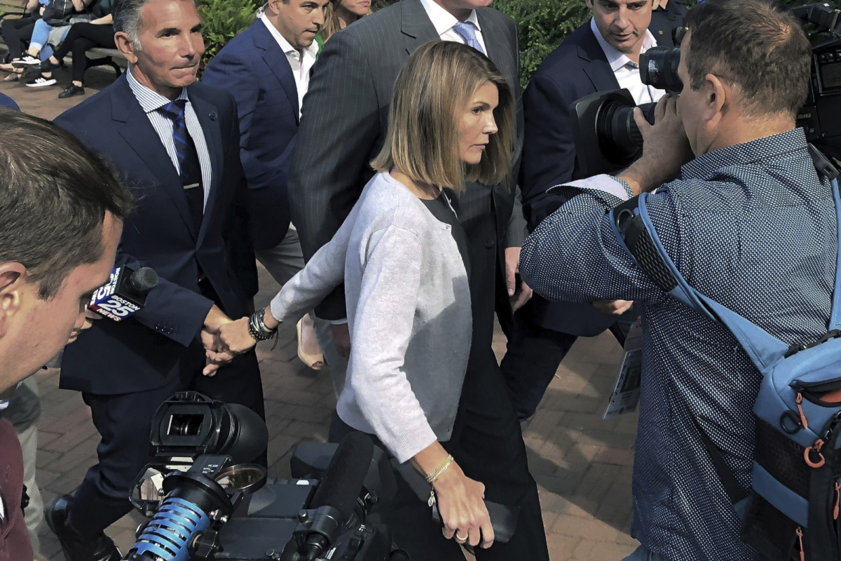 Lori Loughlan departs with husband