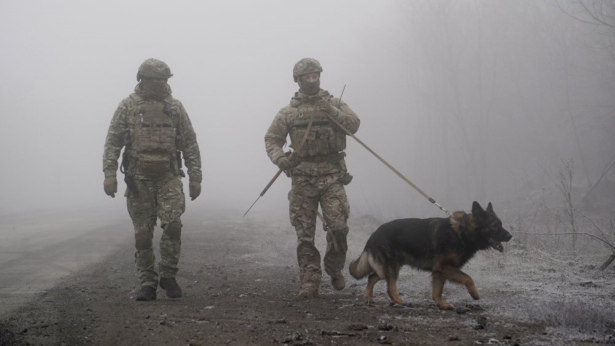 Ukrainian soldiers guard an area
