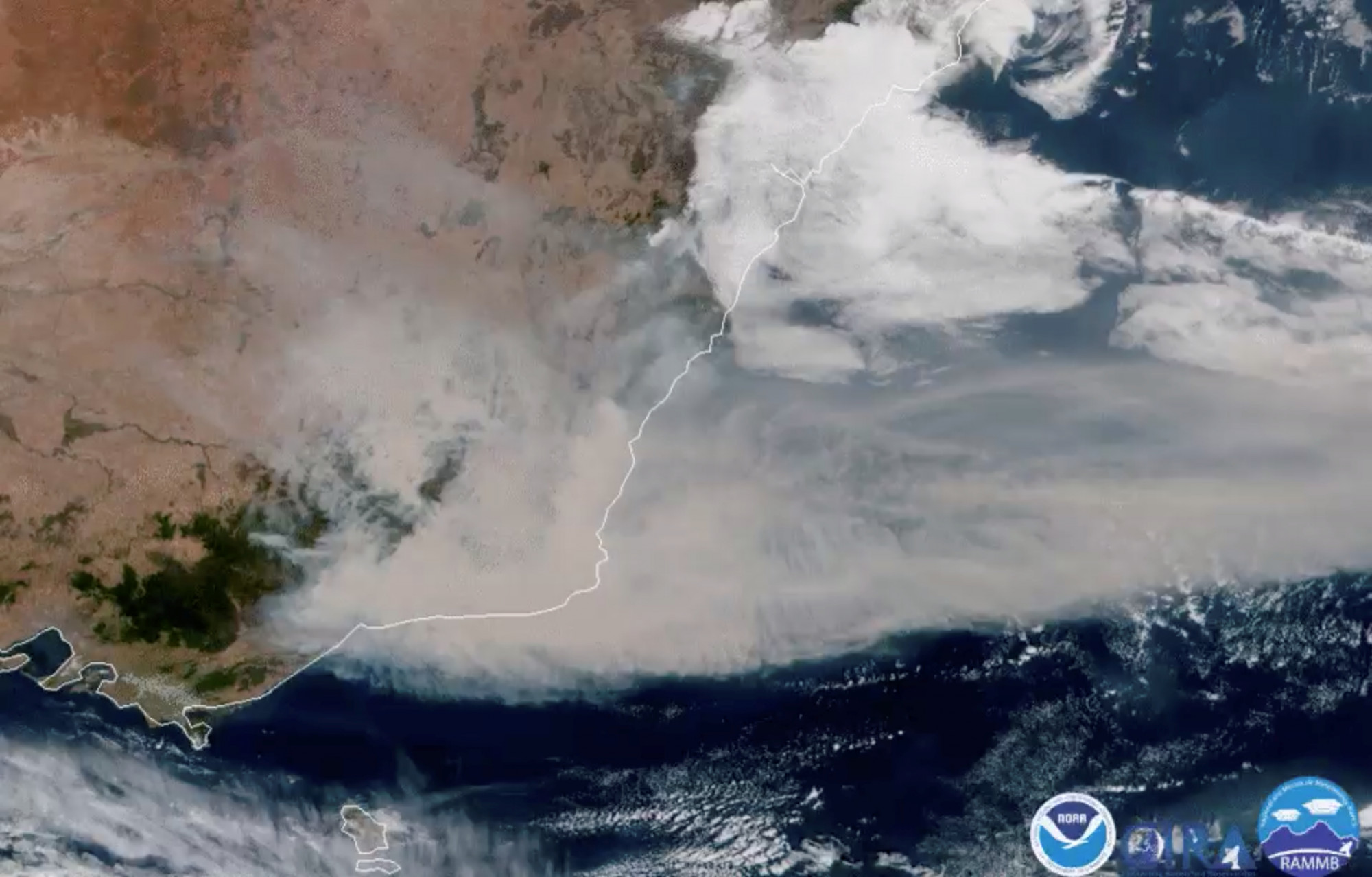 A satellite image shows bushfire smoke being blown away