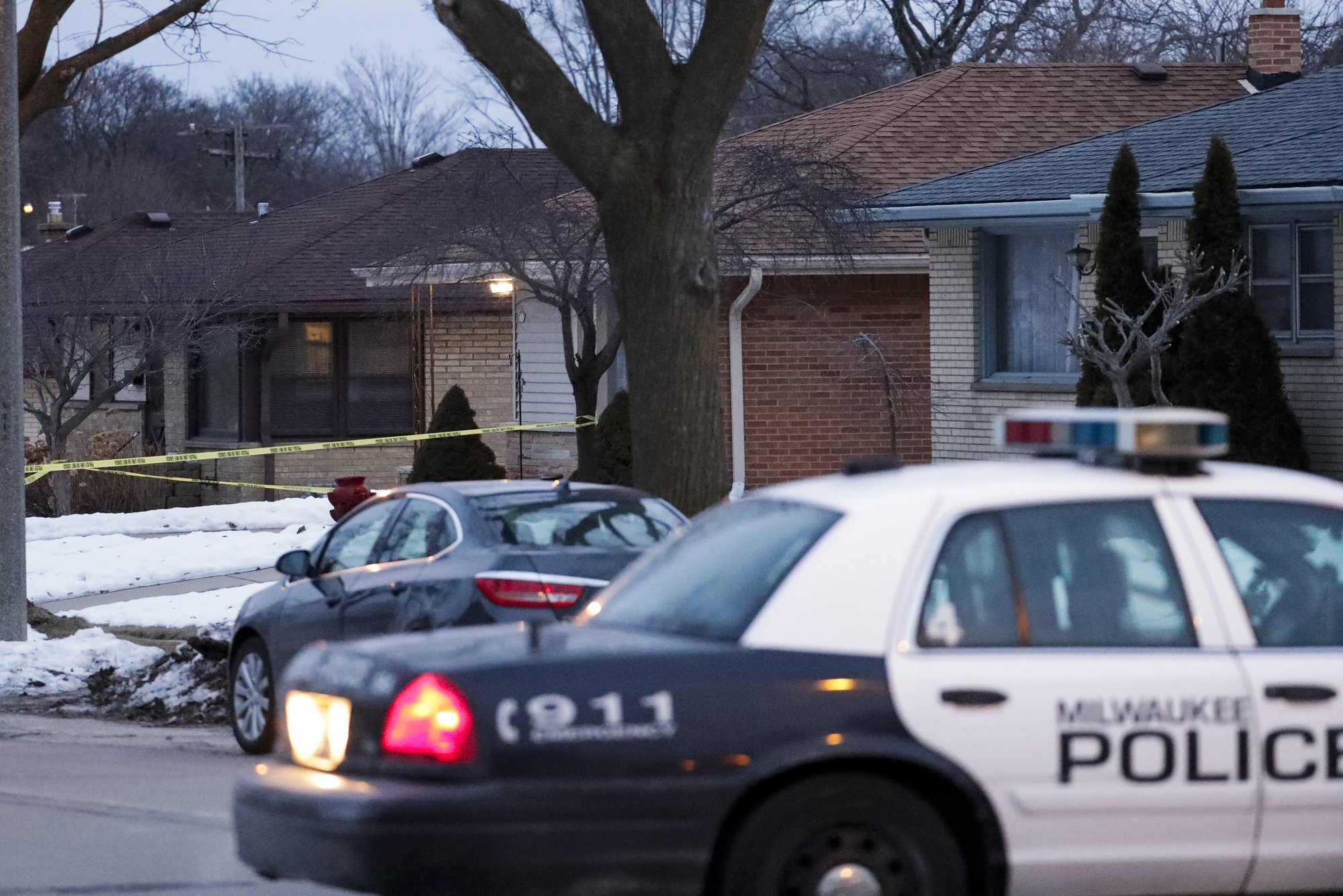 Police are seen outside of a house