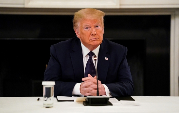 Trump sits