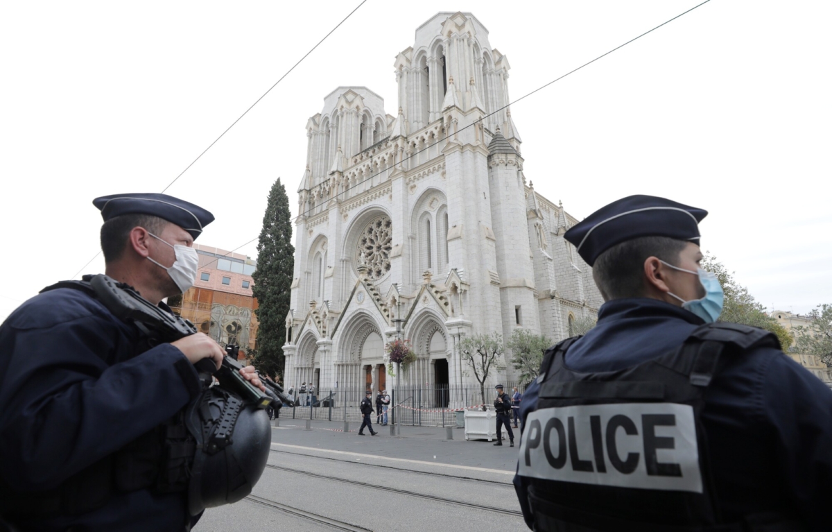 Police officers stand guard