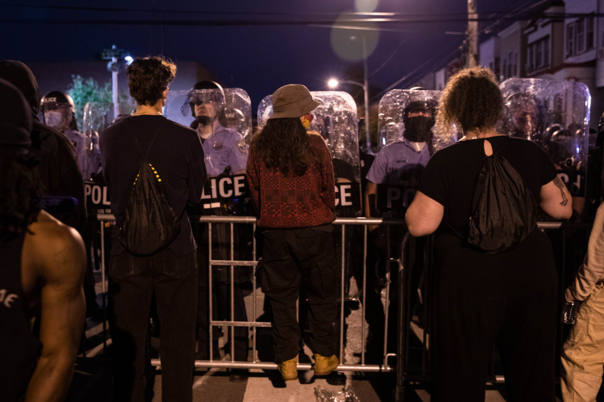 Protesters face police in riot gear