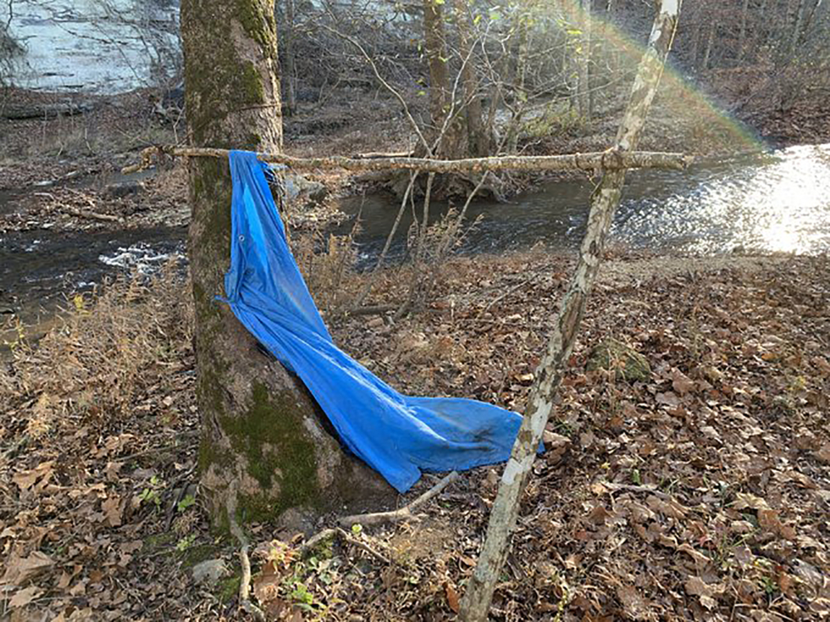 The creekbed and tarp where Jordan Gorman was found