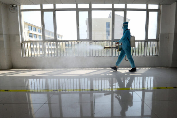 A staff member wearing protective gear