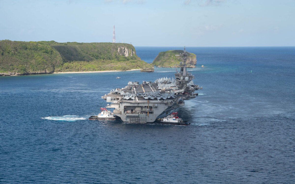 The U.S. Navy aircraft carrier USS Theodore Roosevelt departs following an extended visit in the midst of a coronavirus disease outbreak in Guam