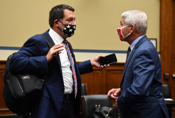Rep. Green (L) talks to Dr. Fauci