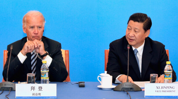 Then Chinese Vice Chair Xi Jinping (R) speaks during talks with then U.S. Vice President Joe Biden