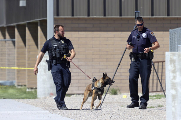 Police walk outside Rigby Middle School following a shooting