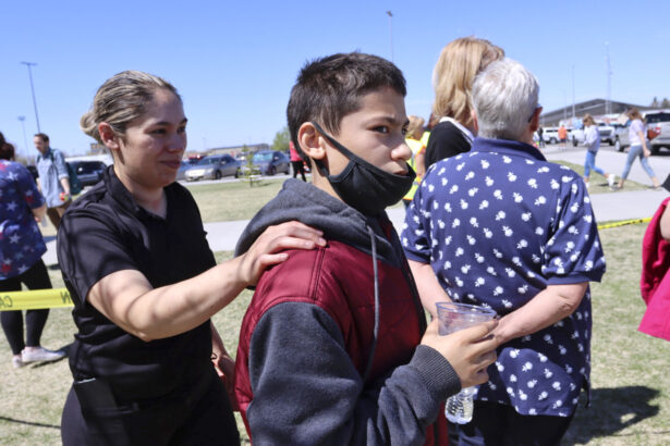 Adela Rodriguez, left, walks with her son, Yandel Rodriguez