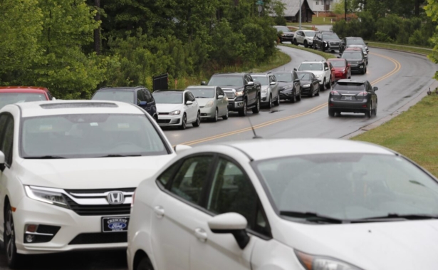Cars line up on Pine Plaza Drive for gas