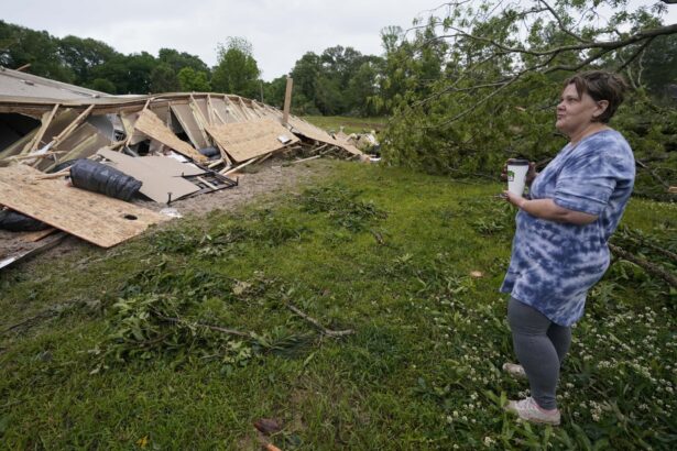 Vickie Savell looks at the remains of her new mobile home early