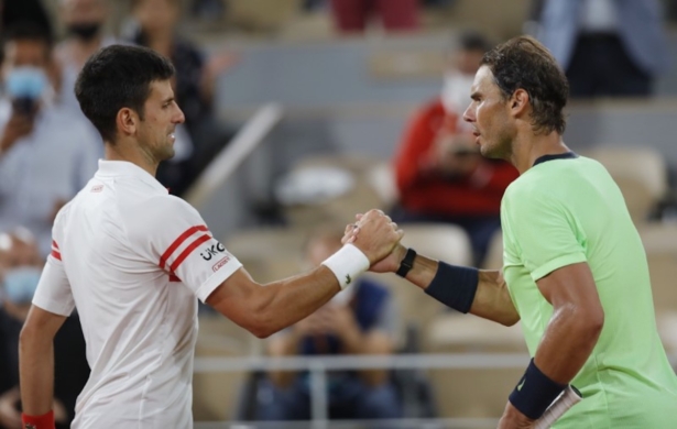 Djokovic shakes hands with Nadal