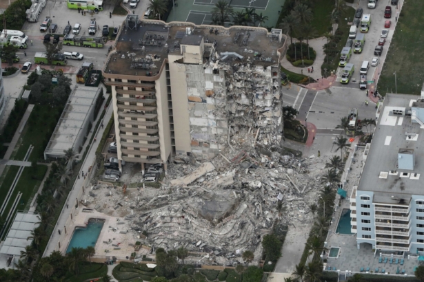 This aerial photo shows part of the 12-story oceanfront Champlain Towers South Condo that collapsed in Surfside, Fla., early on June 24, 2021. (Amy Beth Bennett/South Florida Sun-Sentinel via AP)