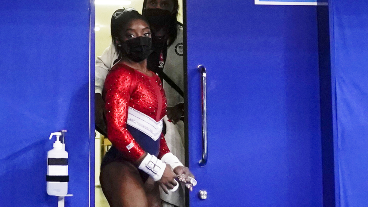 Biles, of the United States, leaves a medical station