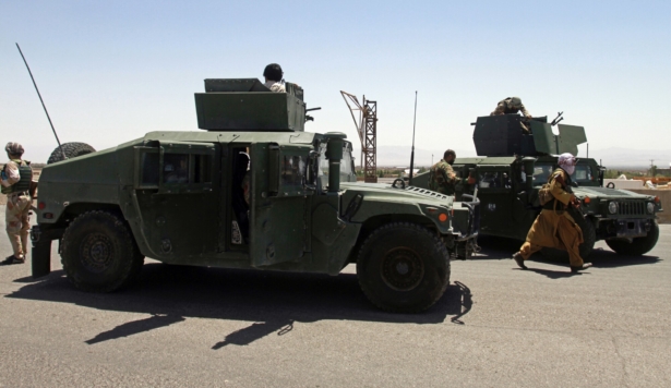 Afghan security personnel patrol