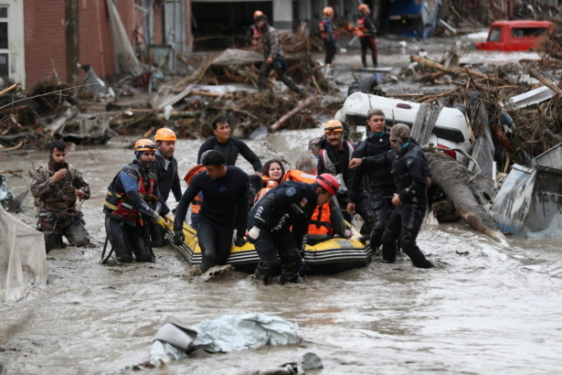 Search and Rescue team members evacuate locals
