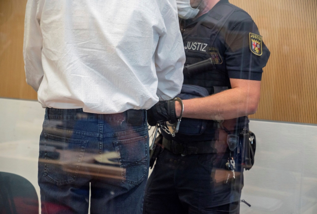 official-checks-handcuffs-of-defendant