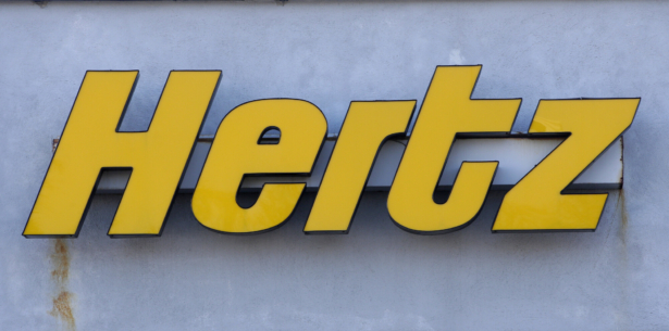 A Hertz rental car logo rests