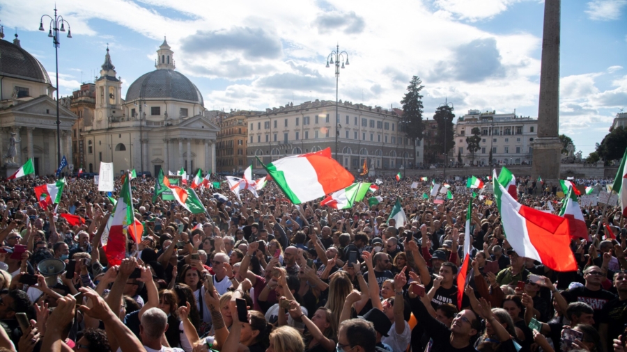 People wave national flags during a protest in Rome, Italy, on Oct. 9, 2021. (TIZIANA FABI/AFP via Getty Images)