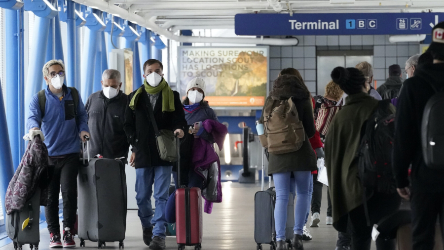 Nearly 2,000 Flights Canceled Sunday Amid COVID-19 Staffing Issues, Snowstorm